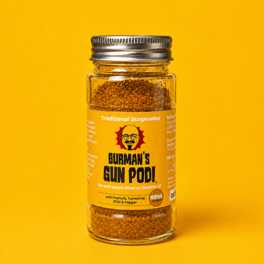 Jar of Burman's Gun Podi on a yellow background