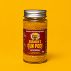 Jar of Burman's Gun Podi spice on a yellow background