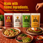 All four Burman's Gun Podi variants — Spicy, Classic, Moderate, and Heritage Traditional Gunpowder - displayed with gourmet dishes including pasta, avocado bowl, and grain salad, made with finest ingredients sourced across India